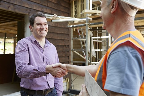 Contractor and client shaking hands