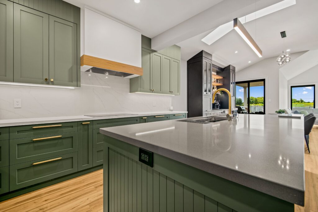 open concept green kitchen