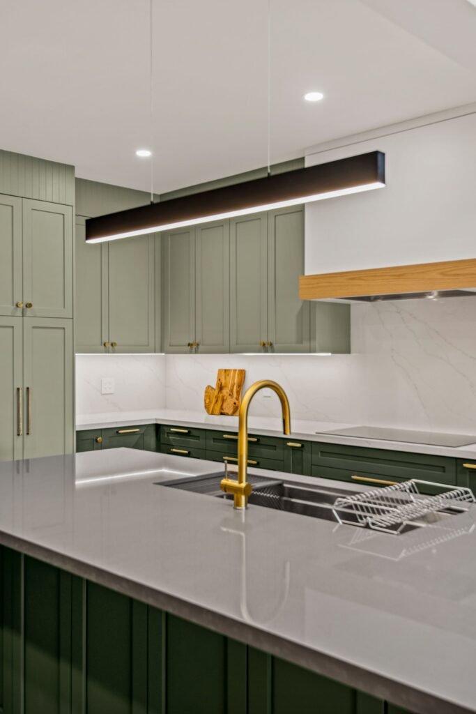 open concept green kitchen kitchen island