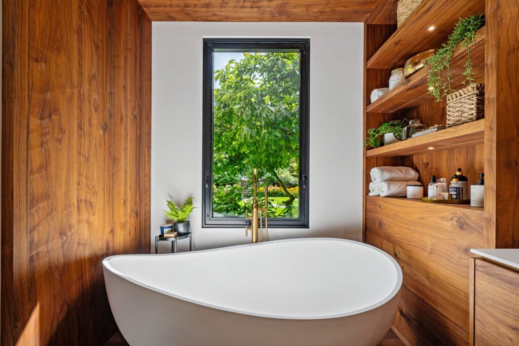 Luxury Bathroom with Zitta Slik Evoque Tub and Garden View