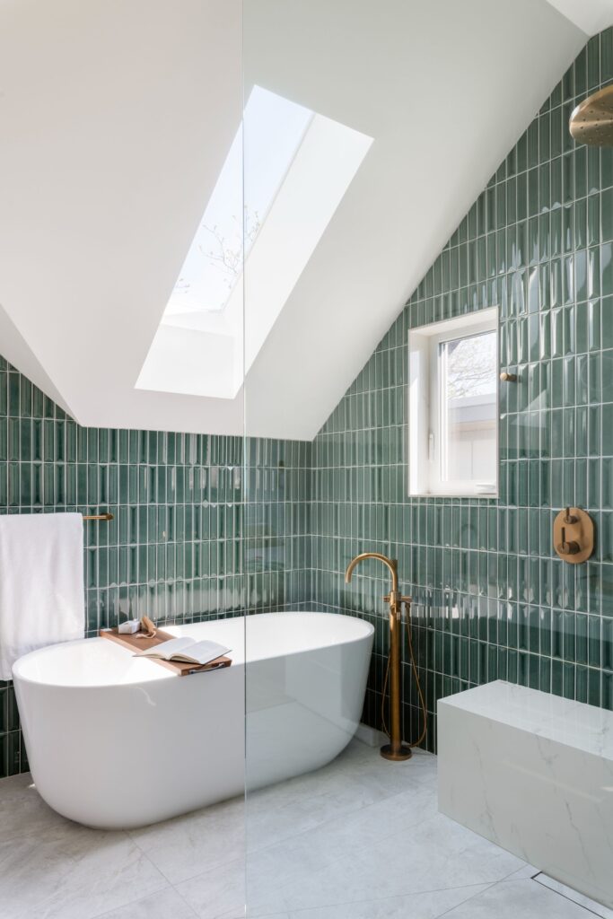 Luxurious ensuite with a stand-alone soaker tub in a 1906 home.