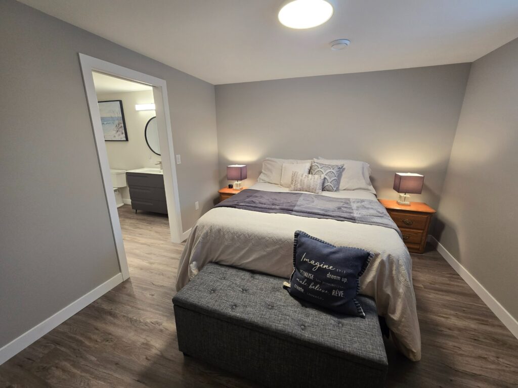 Contemporary color scheme enhancing the basement's luxury feel.