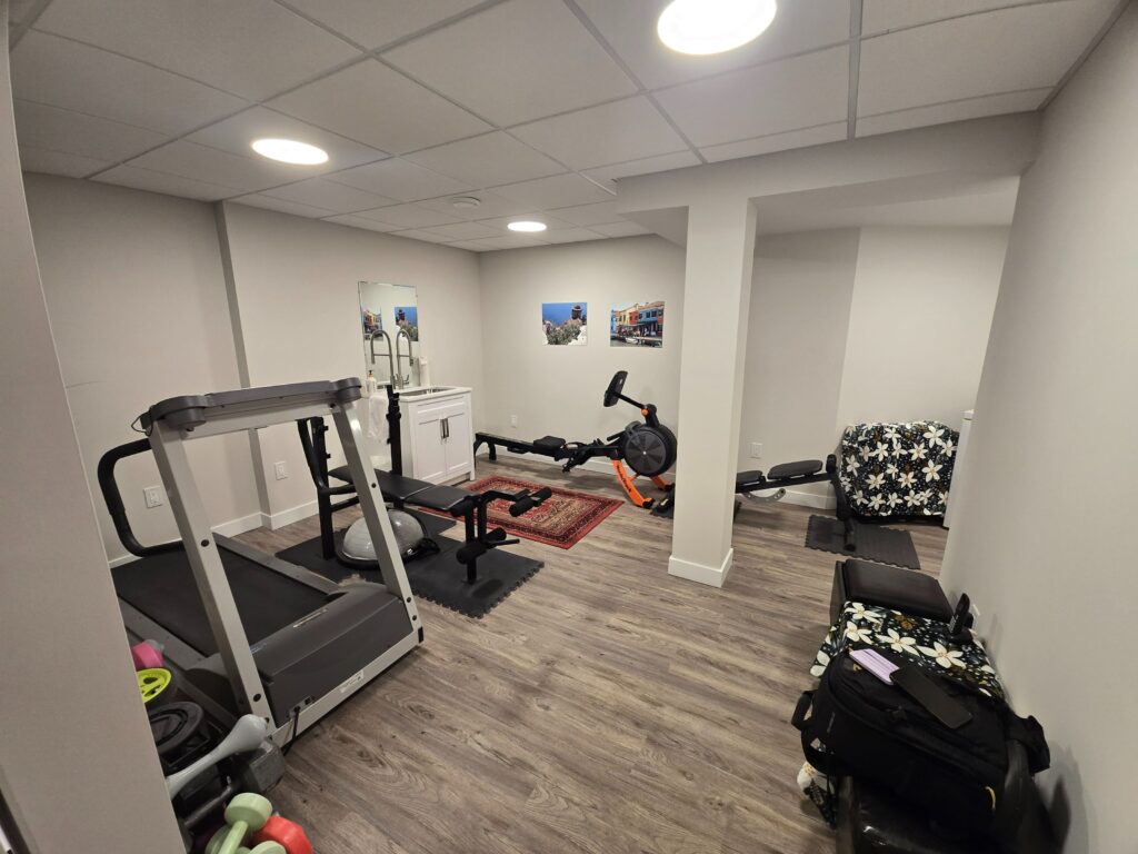 Spare room equipped for workouts and additional storage.