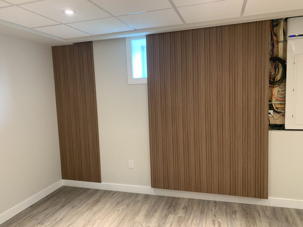 Custom wood slat feature wall as a living area focal point.