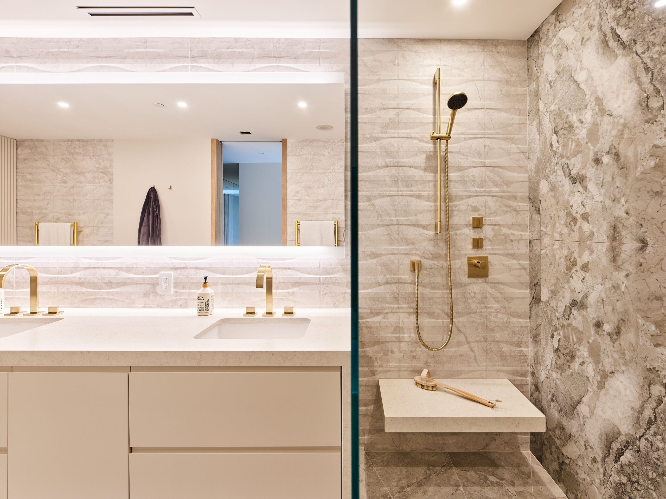 Champagne-Gold Faucets: Luxurious champagne-gold faucets complement the contemporary aesthetics throughout the ensuite.