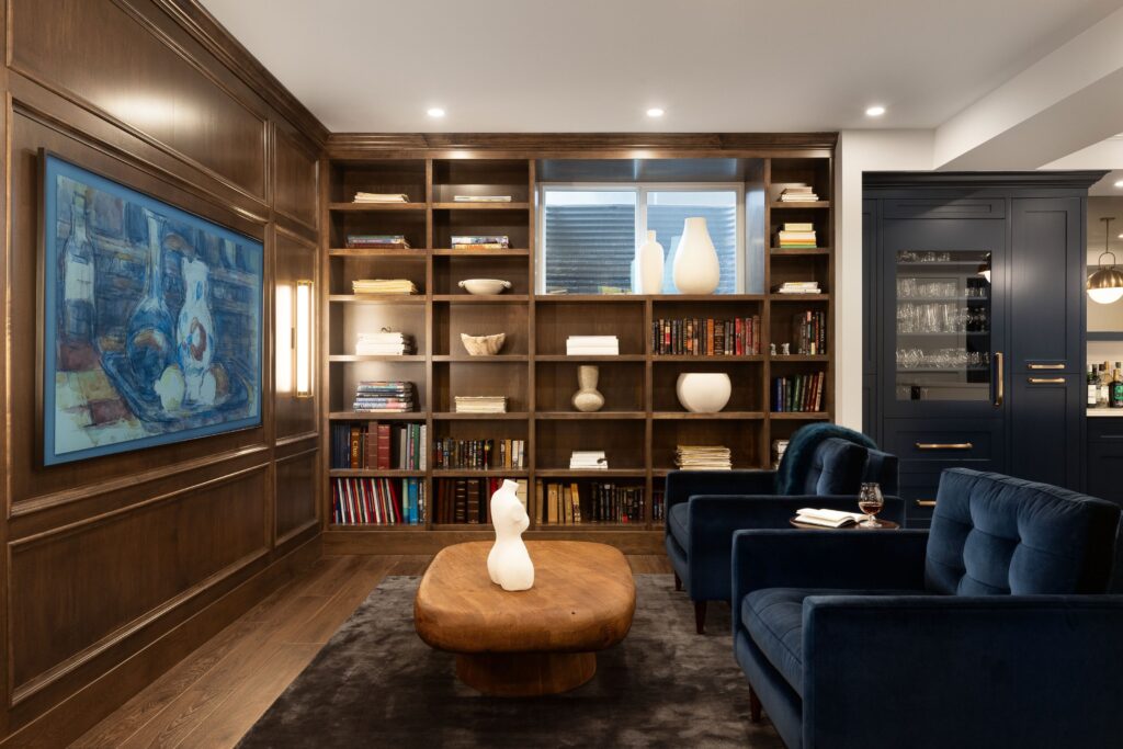 Bookshelves built around a window allowing natural light in.