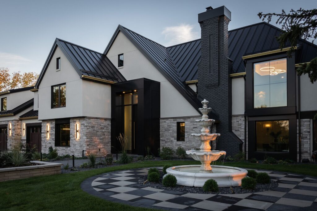 Side angle of the modernized home with added exterior insulation and high-efficiency windows, enhancing energy performance and comfort.