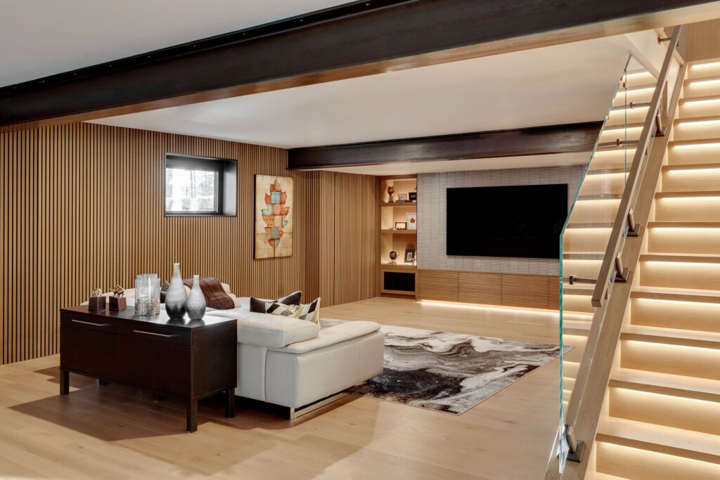 Structural beams incorporated into elegant basement design.