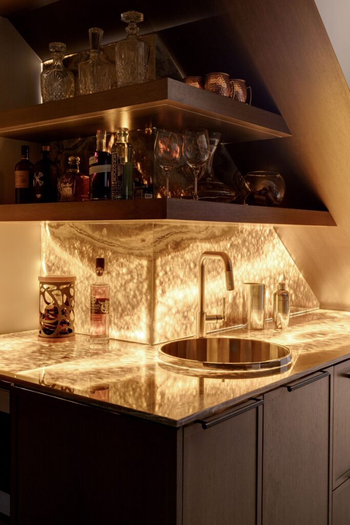 Dramatic atmosphere created by backlit onyx bar.