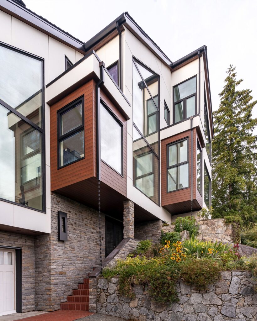 Front entrance with black Cambrian ledgestone and wood door
