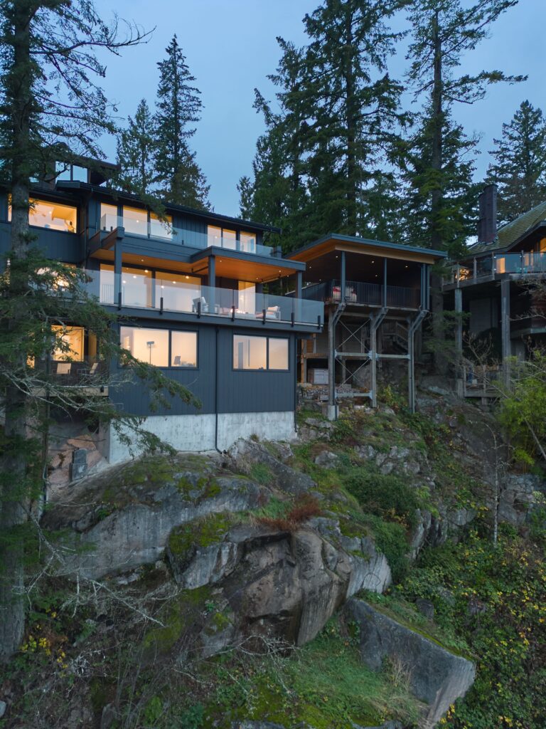 Glowing windows in wooded setting