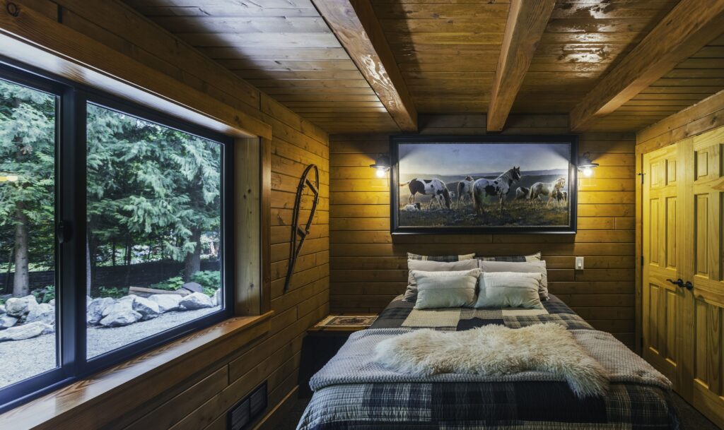 Guest bedroom with log cabin charm