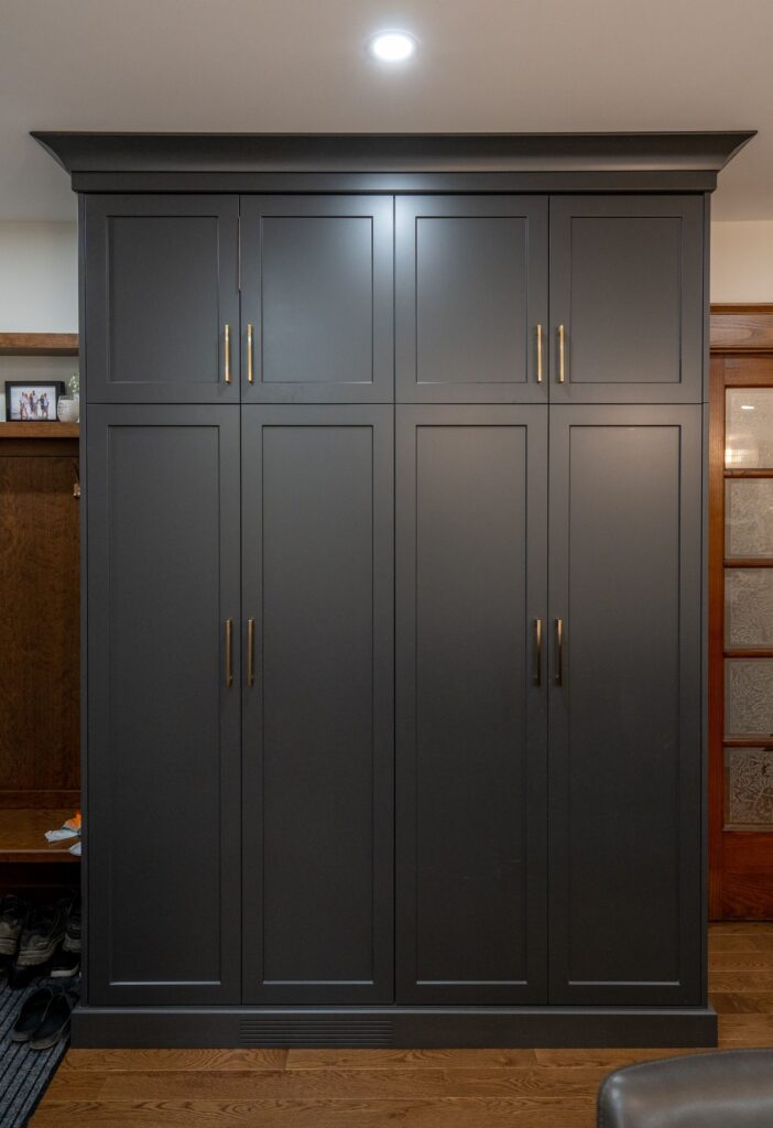 Cabinetry painted Chantilly Lace with striking dark island