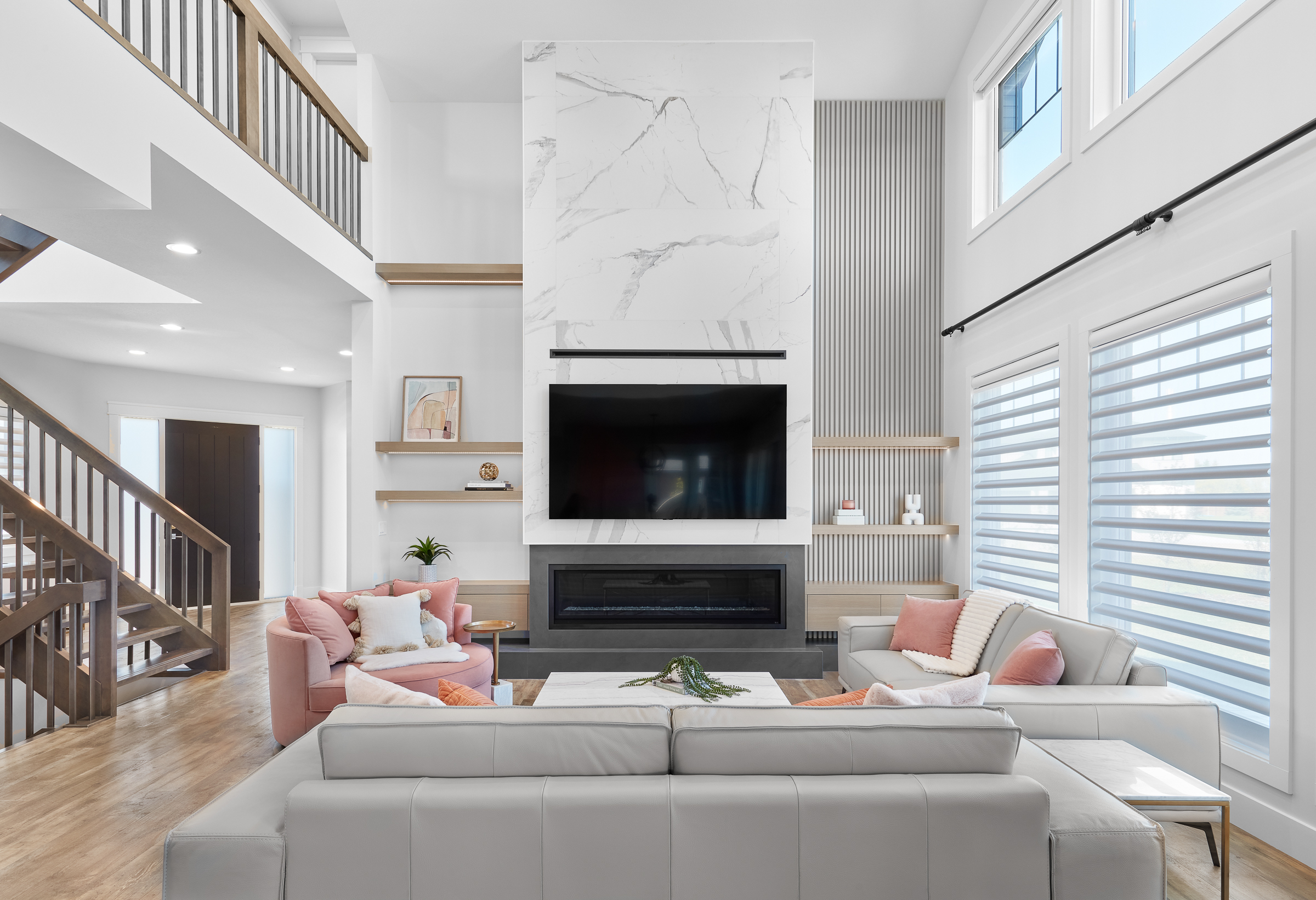 bright and airy living room , with fire place and mounted TV