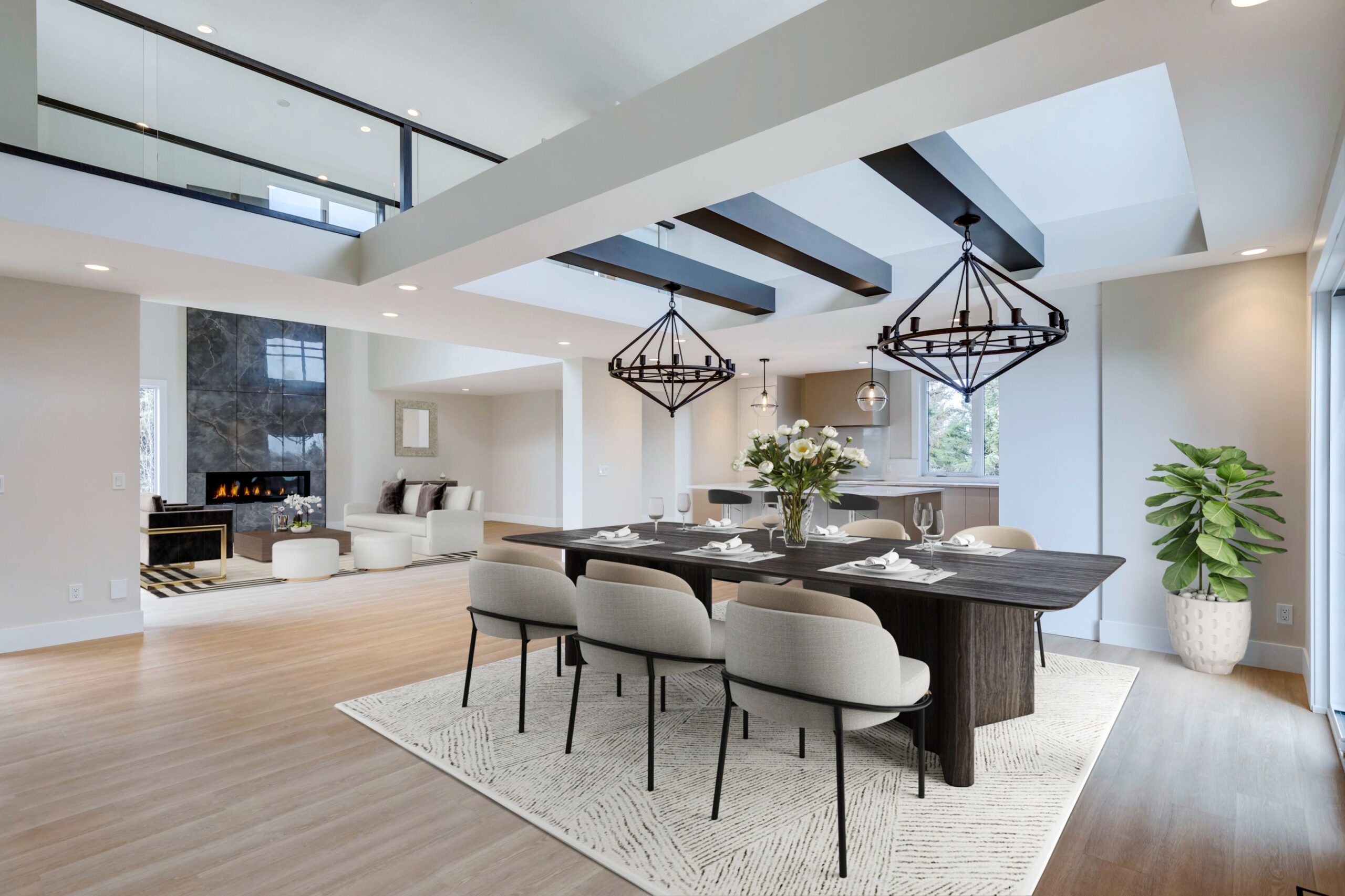 Dining area in modern home renovation with stained beams and streamlined open layout.