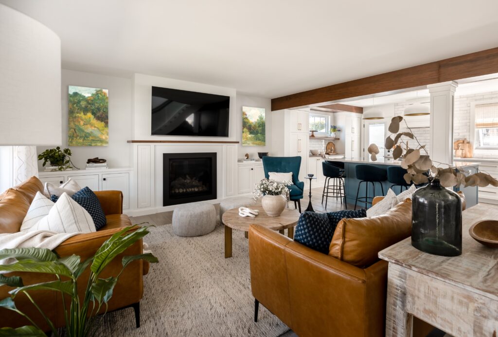 A living room with a fireplace and a tv.