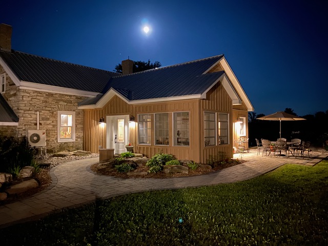 A house with a patio and lawn.