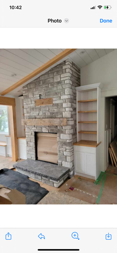 A fireplace in a room.