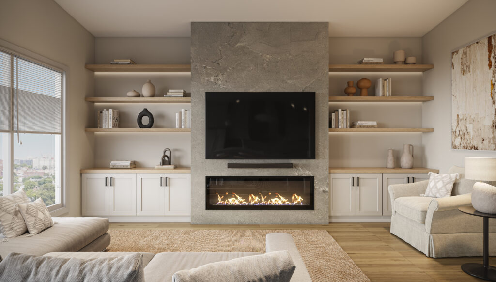 Modern living room with a large TV mounted above a stone fireplace, built-in shelves with decor and books on both sides, a beige rug, light sofas, and a big window letting in natural light.