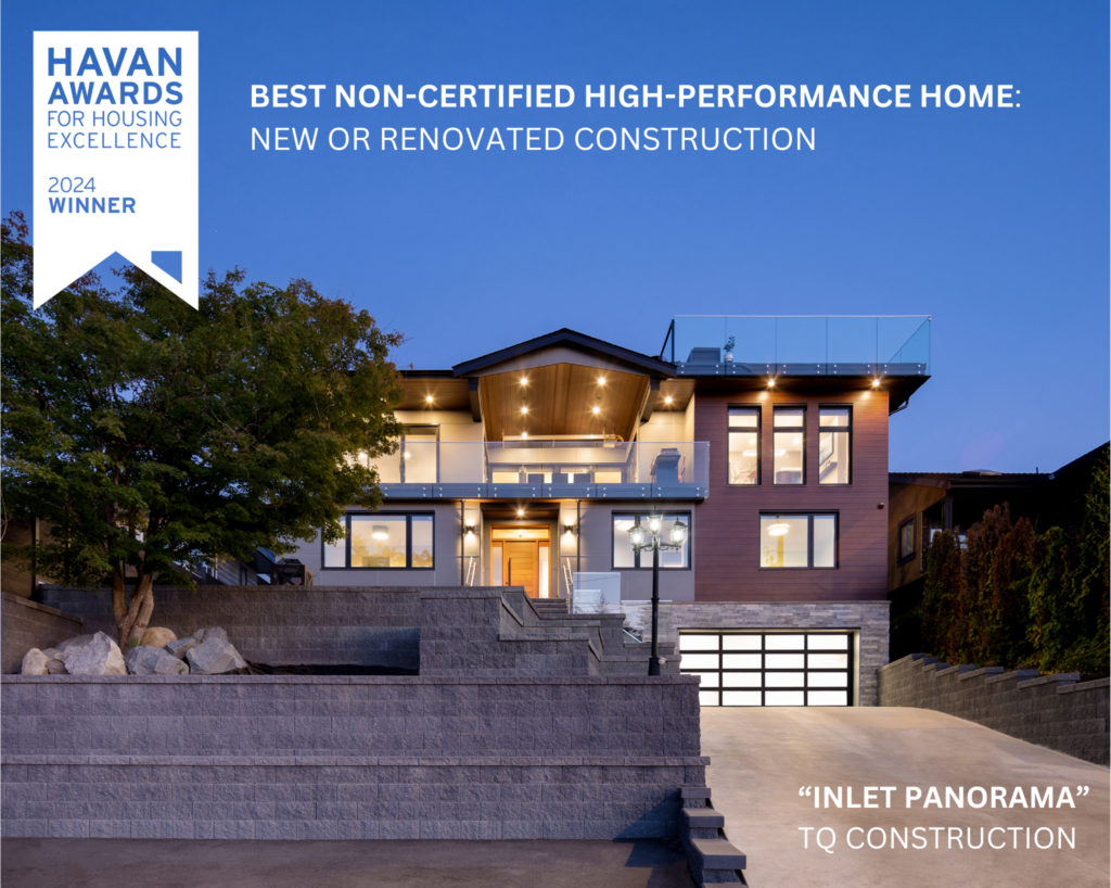 A house with a driveway and trees.