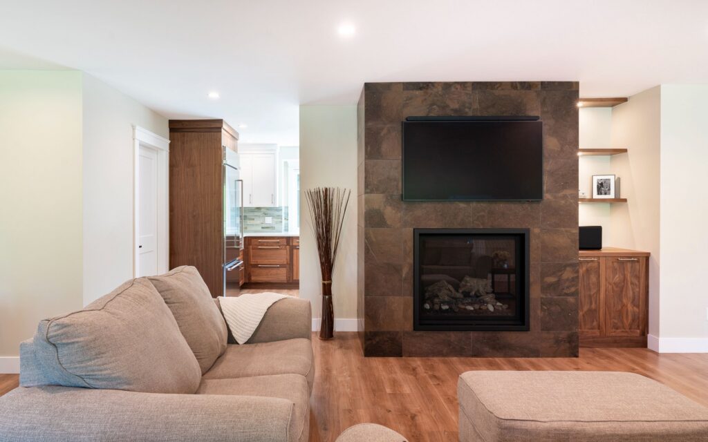 A living room with a fireplace and a tv.
