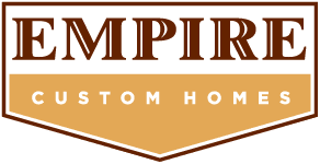 Empire Custom Homes logo with EMPIRE in large brown letters above CUSTOM HOMES in white on a gold background, both enclosed in a shield-shaped outline. Celebrate style and craftsmanship—October is Renovation Month!.