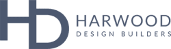 Logo with the large letters HD on the left and the text HARWOOD DESIGN BUILDERS in a modern, sans-serif font on the right, all in a muted blue color—perfect for showcasing your brand during October is Renovation Month.
